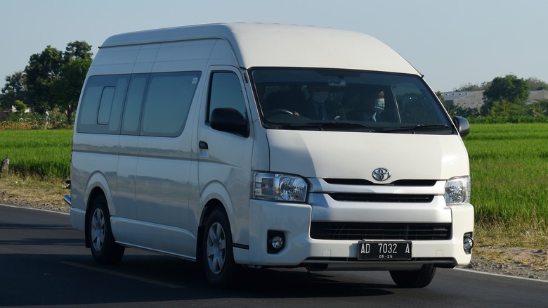Boyolali,,Central,Java,,Indonesia-july,19,,2023:,White,Toyota,Hiace,Passing